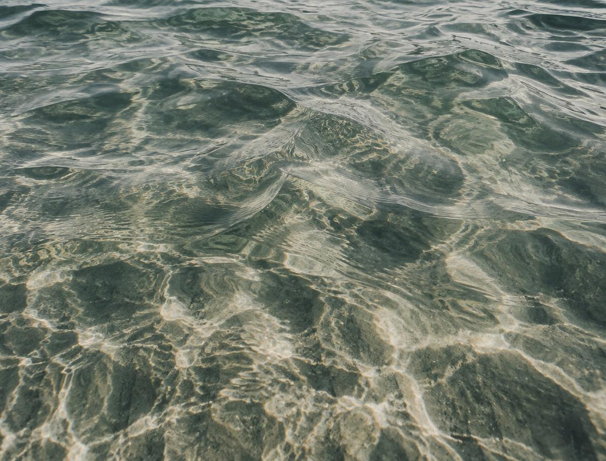 Close detail of shallow Pacific water, ripples refracting light